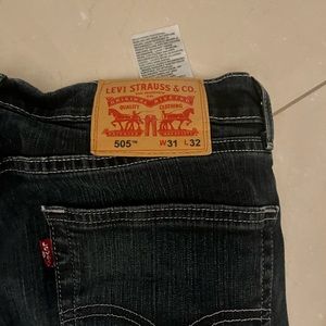 Vintage Levi jeans, used but in good condition, dark blue almost black color.